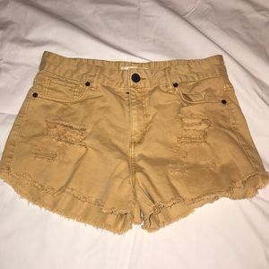 Yellow ripped jean shorts